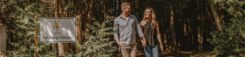 Couple exploring the Wedding Garden at Millcroft Inn & Spa in Caledon
