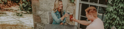 Couple toasting on patio at Headwaters Lounge & Patio at Millcroft Inn & Spa in Caledon