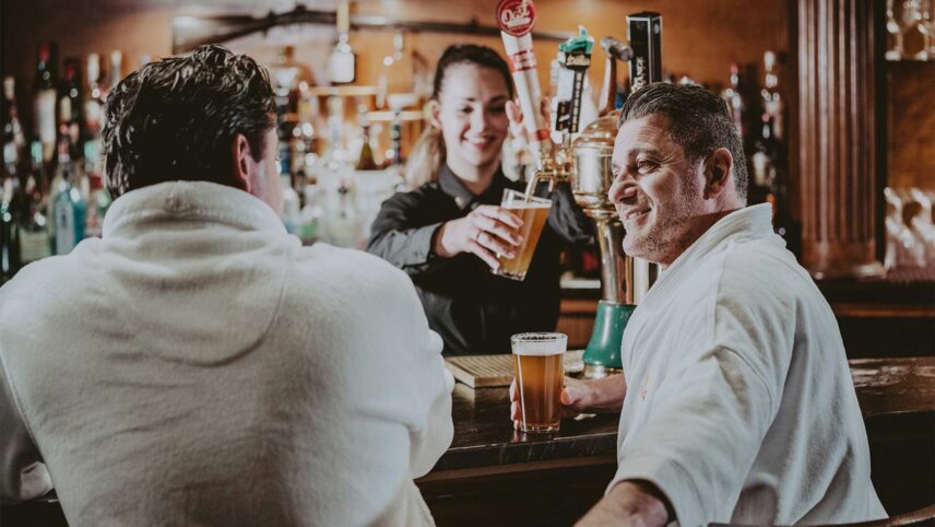 Friends share a drink at the Vintage Wine Bar and Lounge at the Pillar & Post Hotel in Niagara-on-the-Lake
