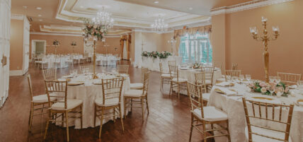 Large ballroom decorated for wedding reception at Queen's Landing in Niagara-on-the-Lake
