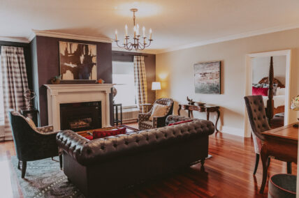 Victoria & Royal Suite living area with gas fireplace at the Queens Landing Hotel in Niagara-on-the-Lake