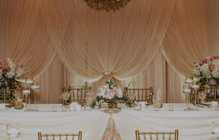Bride and Groom seating in the Georgian Ballroom wedding venue at the Queens Landing Hotel in Niagara-on-the-Lake