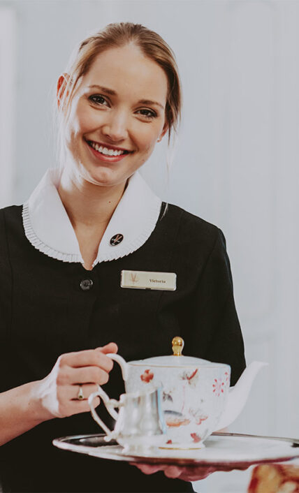 staff member serving tea at Prince of Wales in Niagara-on-the-Lake