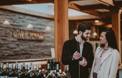 Couple selecting wine at Inn On The Twenty in Jordan Village