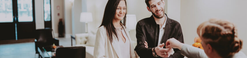 Couple checking in at Inn On The Twenty in Jordan Village