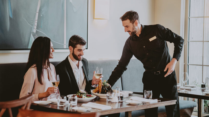 A couple enjoying their meal at Inn On The Twenty Restaurant in Jordan Village