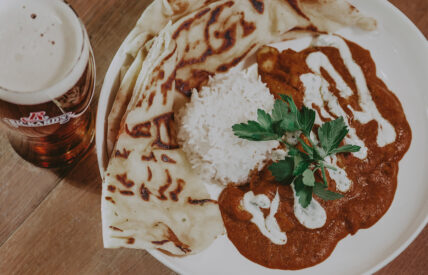 Chicken curry with rice and naan and beer at Jordan House Tavern at Jordan House in Jordan Village