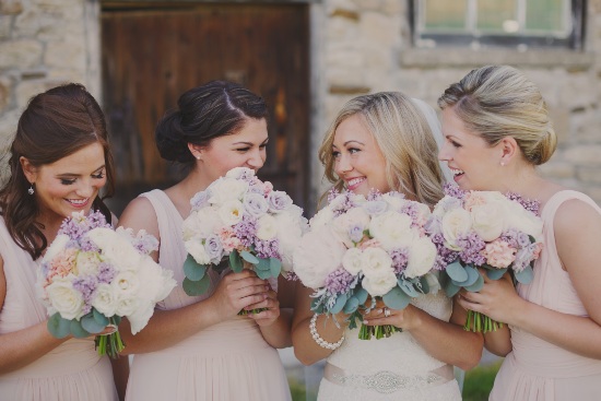 Bride and bridesmaids with personalized bouquets by Clipping’s Floral Designs from Vintage Hotels