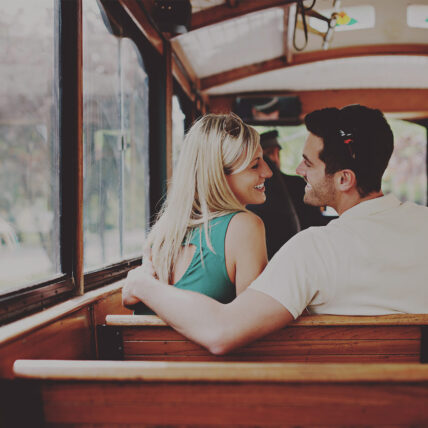 Couple aboard the Vintage Hotels Trolley going on a wine tour