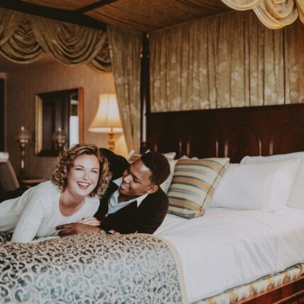 couple in bed in the royal suite at prince of wales hotel