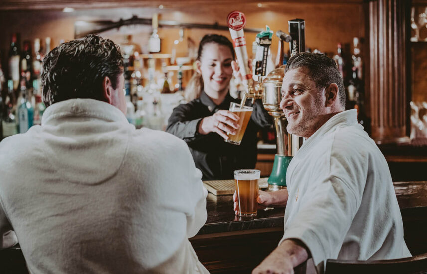 Friends at the bar at Vintages Wine Bar & Lounge at Pillar and Post