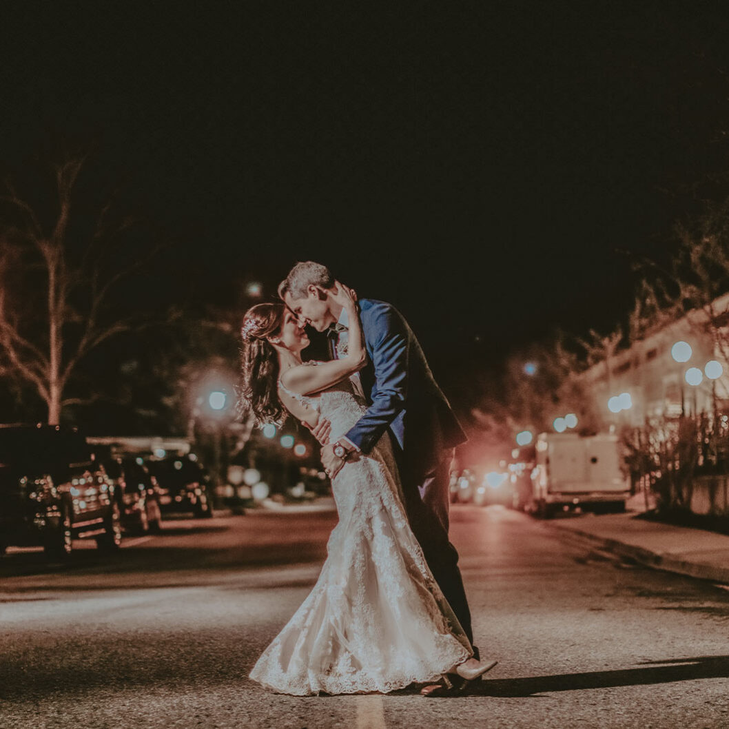 Bride and grooming kissing on New Year's Eve near Inn On The Twenty in Jordan Station