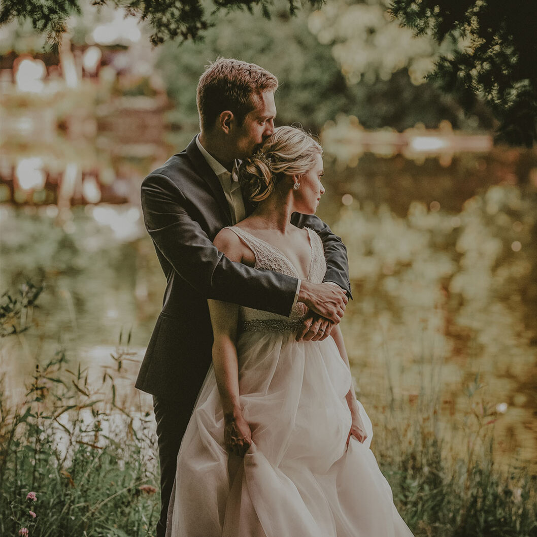 Bride and groom overlooking the mill pond at Millcroft Inn & Spa