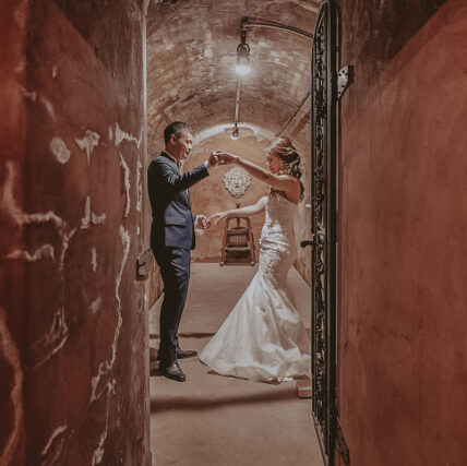 Bride and groom dancing in the Vintner’s Cellar at Inn On The Twenty in Jordan Station