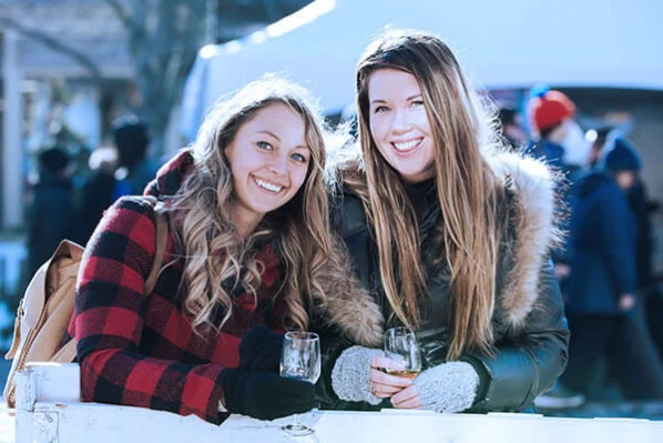 Women drinking icewine at the Icewine Festival in Niagara-on-the-Lake