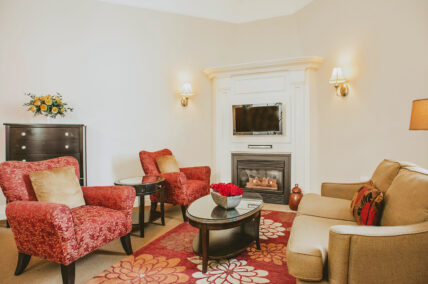 Premium Guest Suite seating area with fireplace at Inn On The Twenty in Jordan Village