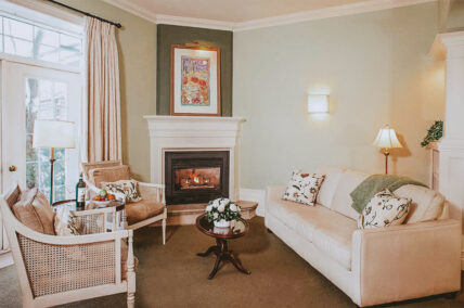 Signature Guest Suite seating area with fireplace at Inn On The Twenty in Jordan Village