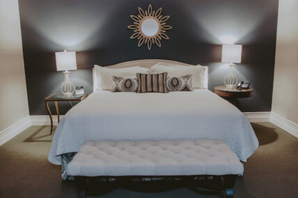 King bed in Vintner’s Loft Guest Suite at Inn On The Twenty in Jordan Village