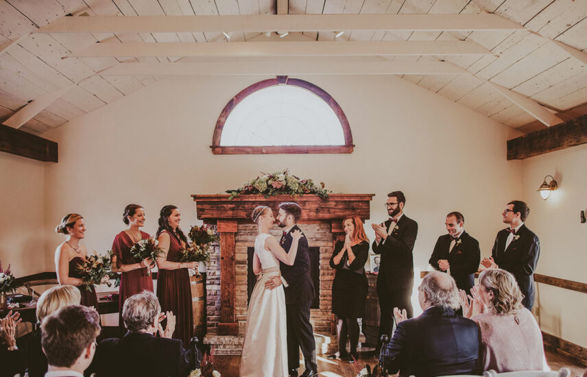 Couple gets married with family and friends at Cave Spring Vineyard at Inn On The Twenty in Jordan Village