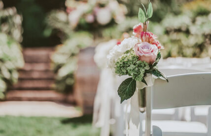 Wedding aisle floral arrangements at The Escarpment Site venue at Inn On The Twenty in Jordan Village