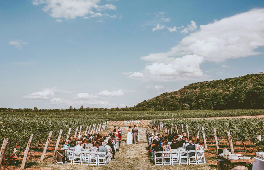Wedding ceremony in progress at Headlands Site vineyard wedding venue at Inn On The Twenty in Jordan Village