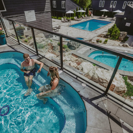 Couple enjoying luxury hot spring pools at Millcroft Spa
