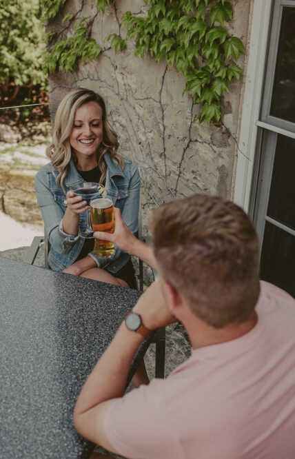 Couple drinking together at Headwater Lounge Patio at Millcroft Inn & Spa