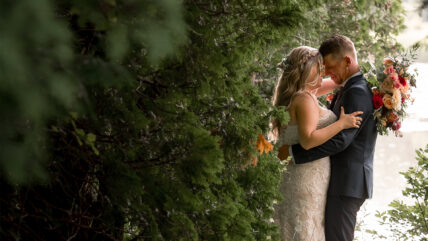 Couple sneaking a moment for themselves on their wedding at Millcroft Inn & Spa in Caledon