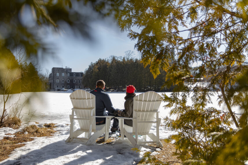 A couple surrounded by maple trees at Millcroft Inn & Spa in Caledon, Ontario.