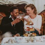 A couple enjoying afternoon tea in Niagara on the Lake in the Drawing Room at Prince of Wales Hotel