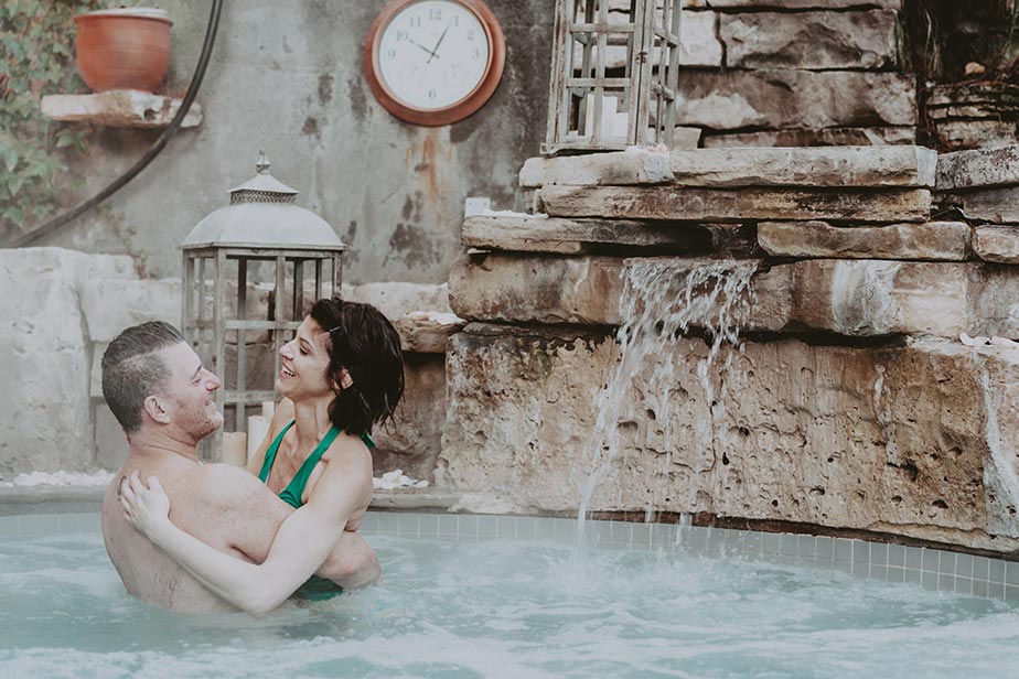 A Couple enjoying the hot spring pool at Pillar and Post in Niagara on the Lake