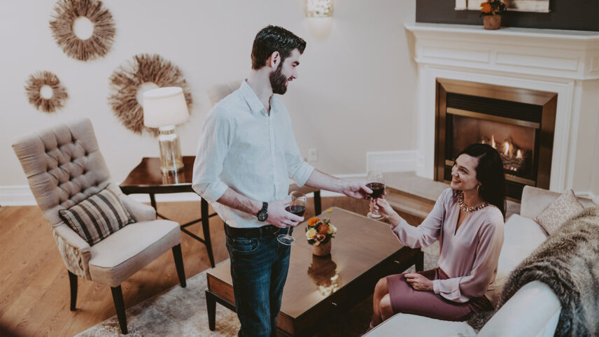 couple cheersing in a guestroom at inn on the twenty