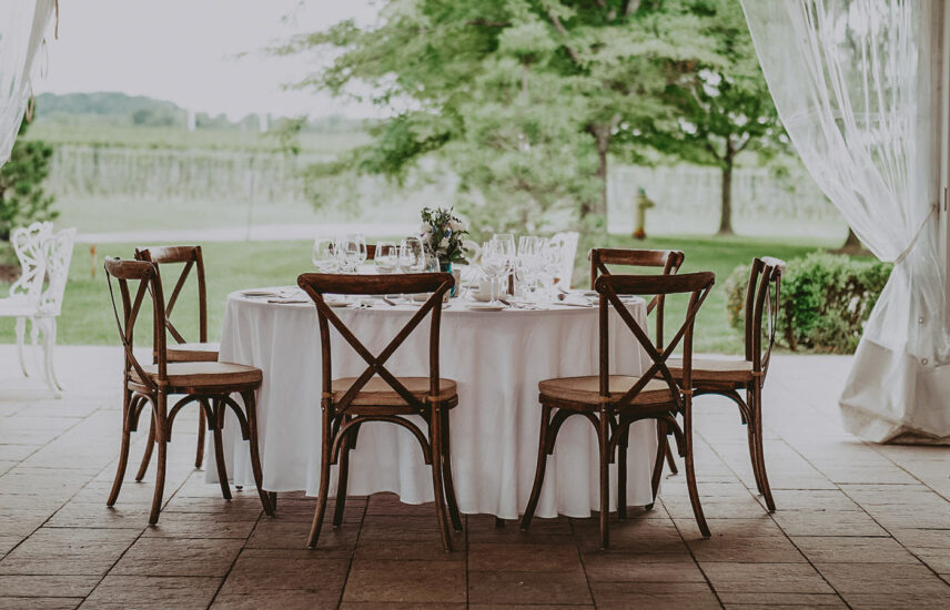 A wedding table overlooking the vineyard at Château des Charmes in Niagara-on-the-Lake.