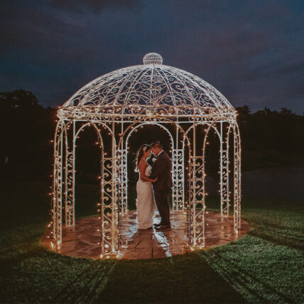 A couple under a gazebo at Sue-Ann Staff Winery in Niagara-on-the-Lake.