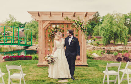 Couple takes their first steps as husband and wife at Le Petit Pavilion wedding venue at Pillar & Post Hotel in Niagara-on-the-Lake