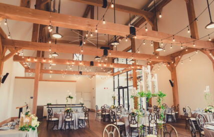 The Barn wedding venue with large windows and wooden beams for airy feel at the Pillar & Post Hotel in Niagara-on-the-Lake