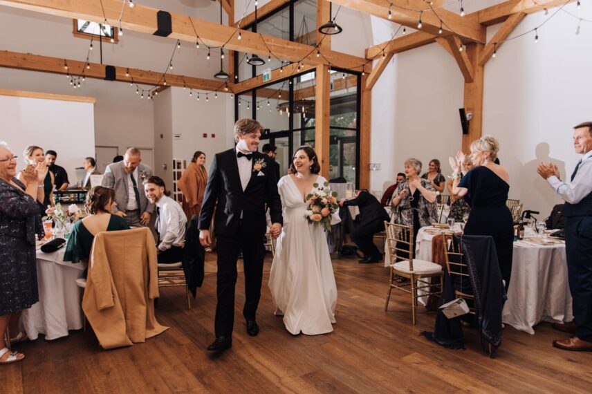 A couple celebrating their wedding reception at The Barn at The Gardens at Pillar and Post in Niagara.