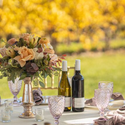 A flower arrangement set up on a dining table during a wedding at Bella Terra Vineyards in Niagara on the Lake
