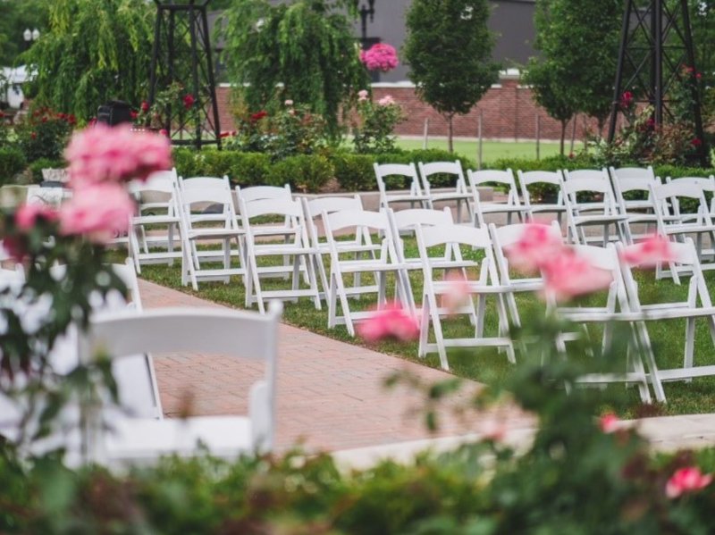 Chairs arranged for a fall wedding in The Gardens at Pillar and Post