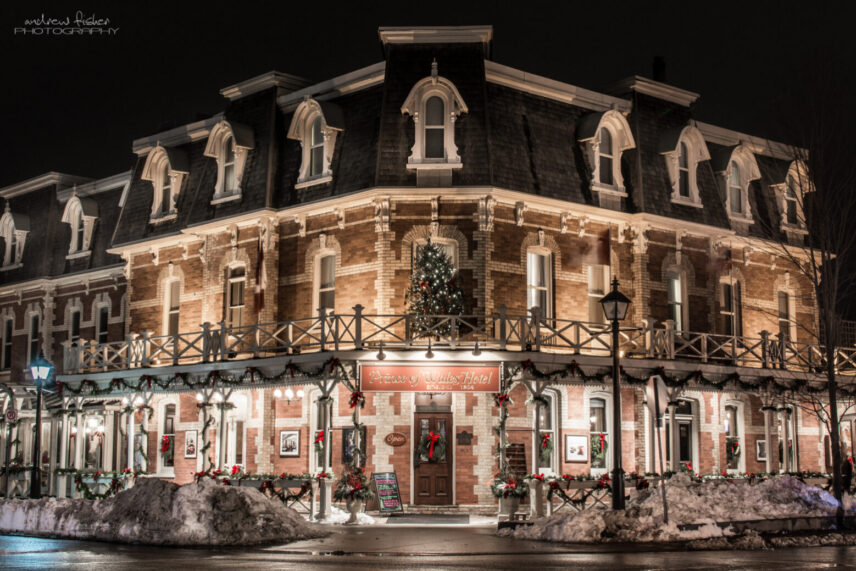 A photo of the Prince of Wales Hotel from the outside at night.