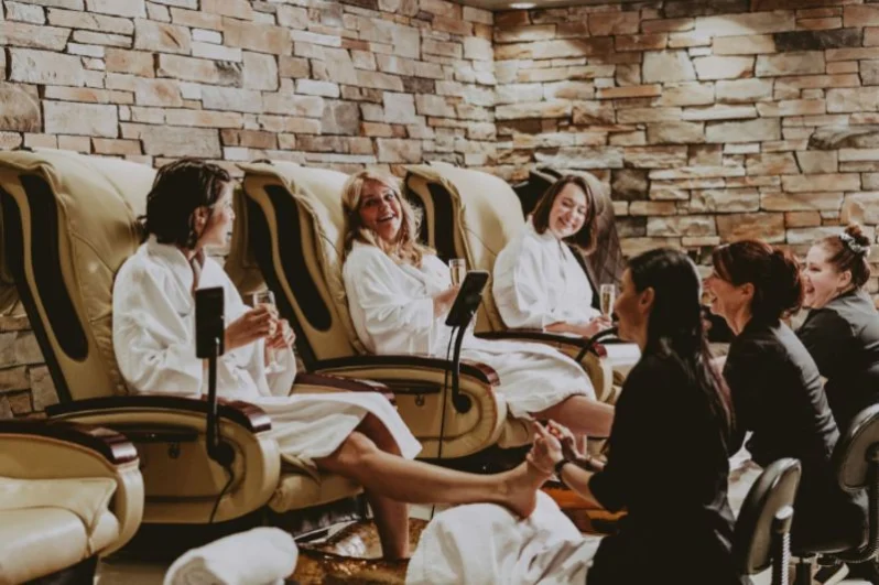 Women getting pedicures on a group vacation in Niagara-on-the-Lake