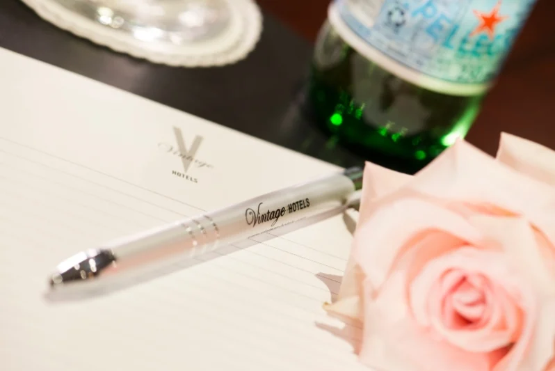 Pen and paper set out during a corporate event at Vintage Hotels