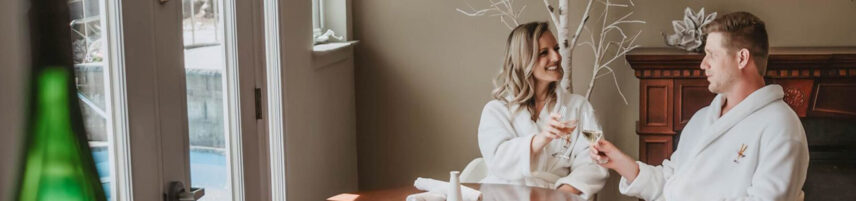 Couple drinking wine while receiving a spa treatment at Millcroft Inn & Spa in Caledon, ON.