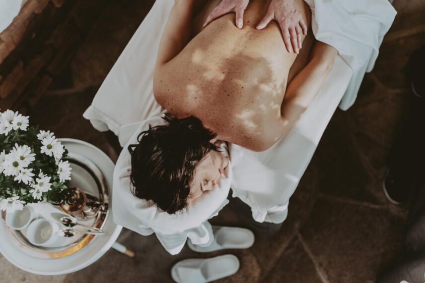 A mom receiving a massage at 100 Fountain Spa in Niagara-on-the-Lake.