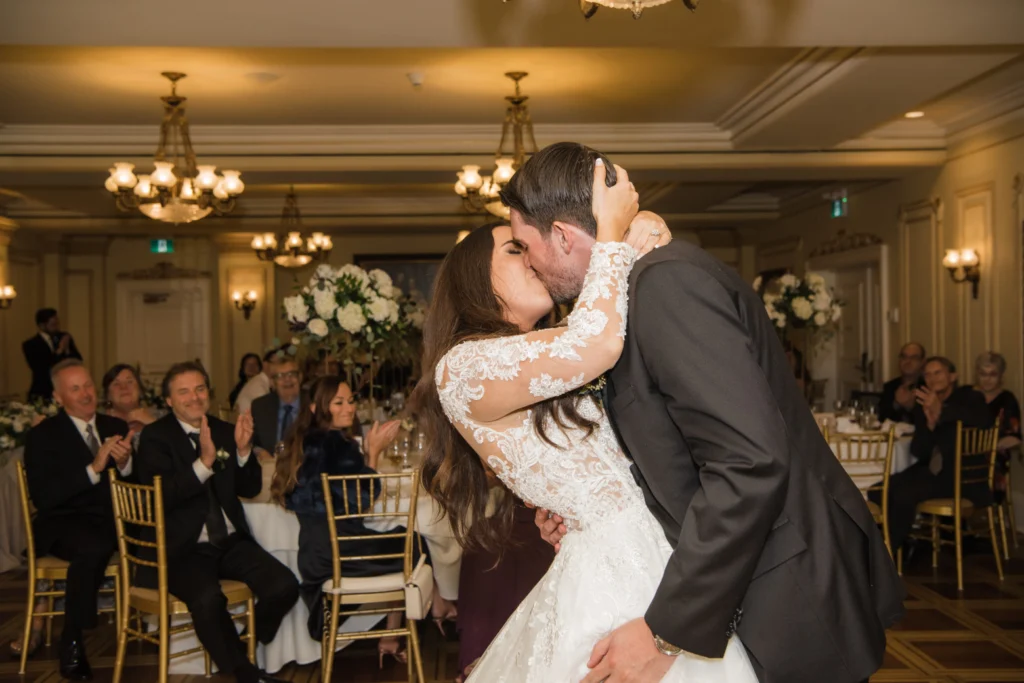 Bride and groom kissing during their first dance