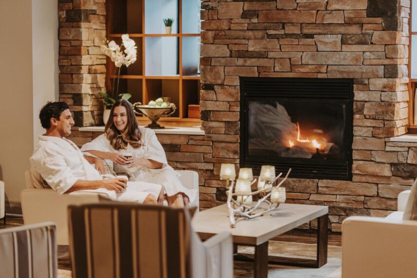 A couple lounging at 100 Fountain Spa at Pillar and Post in Niagara-on-the-Lake.
