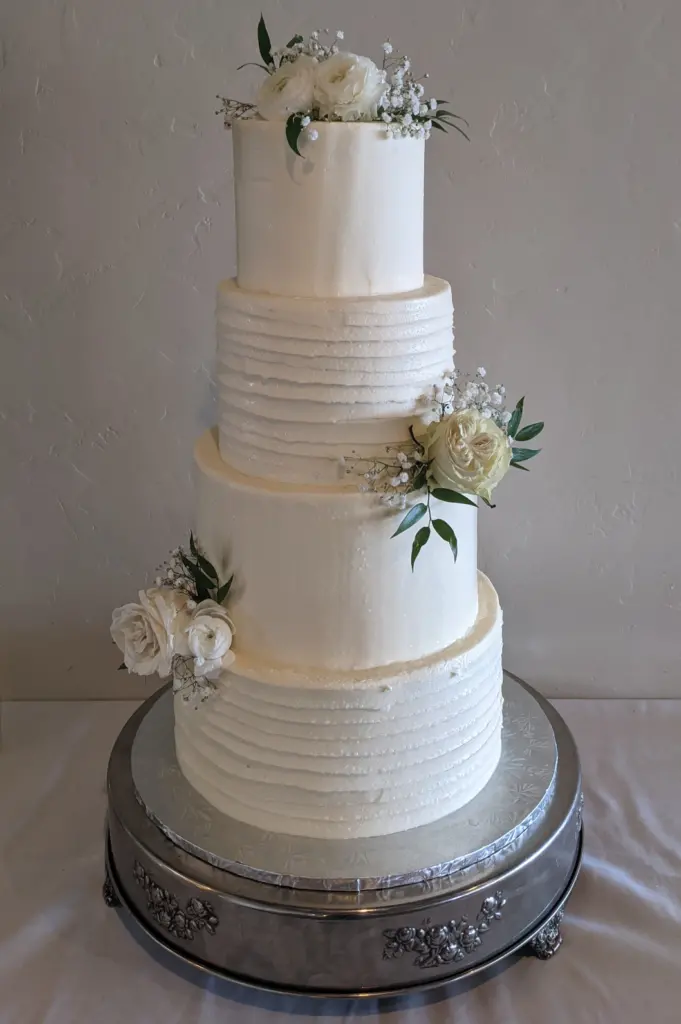 A naked wedding cake, a 2023 wedding cake trend