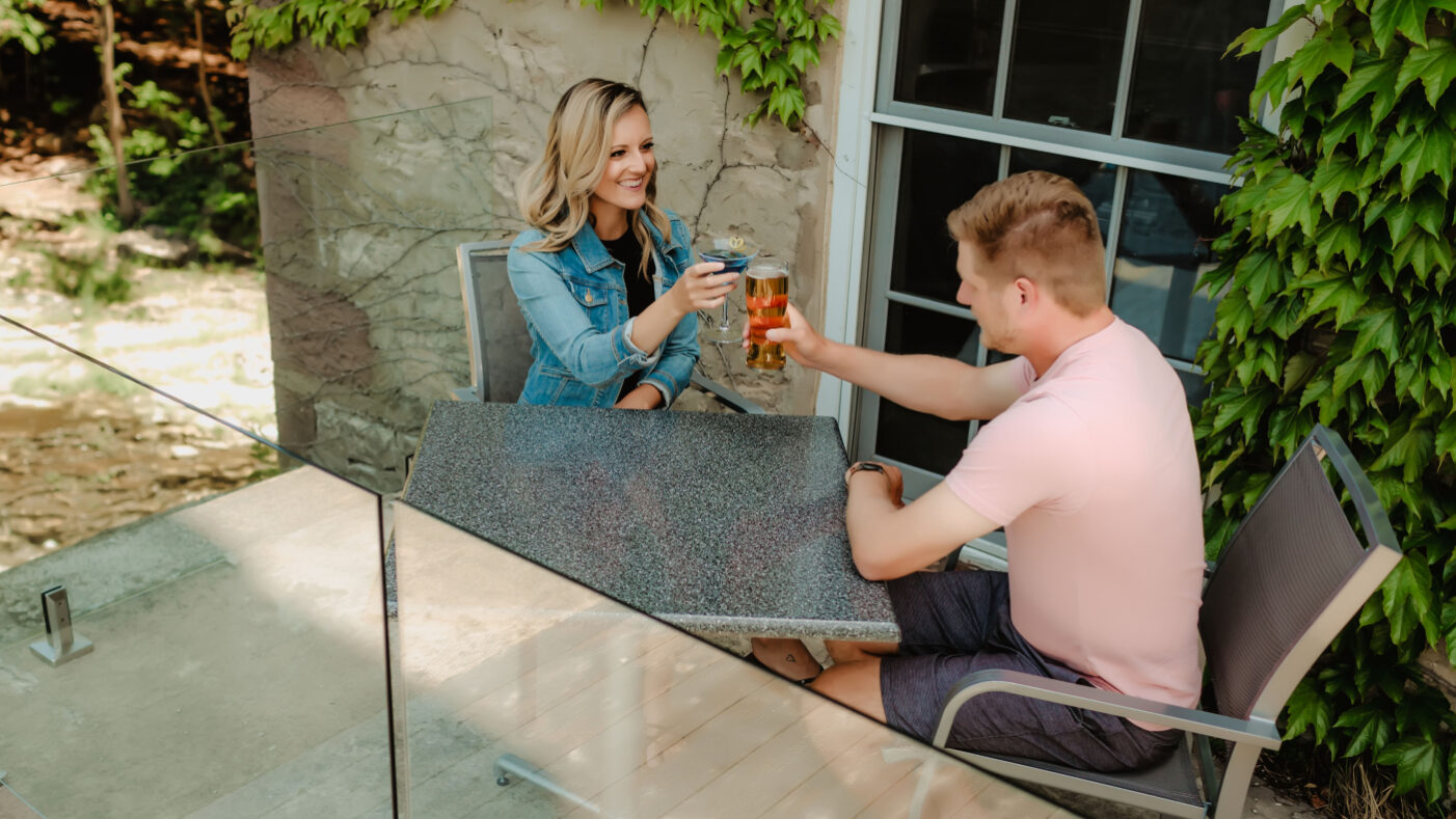 A couple enjoying beer and ciders at Millcroft Inn & Spa in Caledon, Ontario