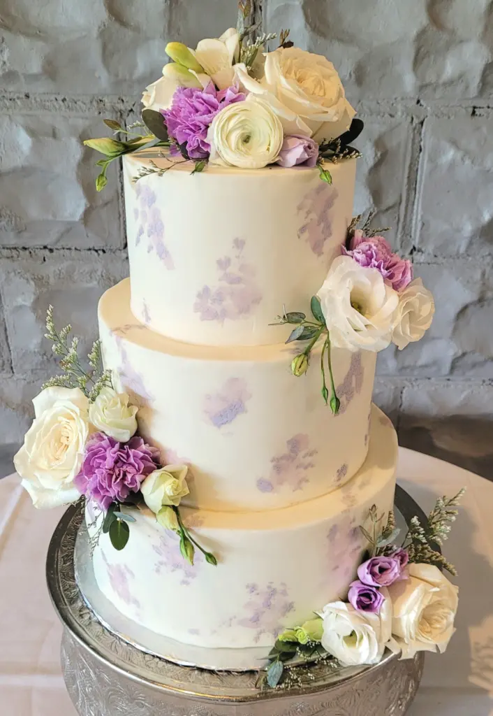 A pressed floral wedding cake, a 2023 wedding cake trend