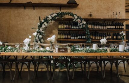Head table of a wedding reception Set-up in The Hare Wine Co. Retail room